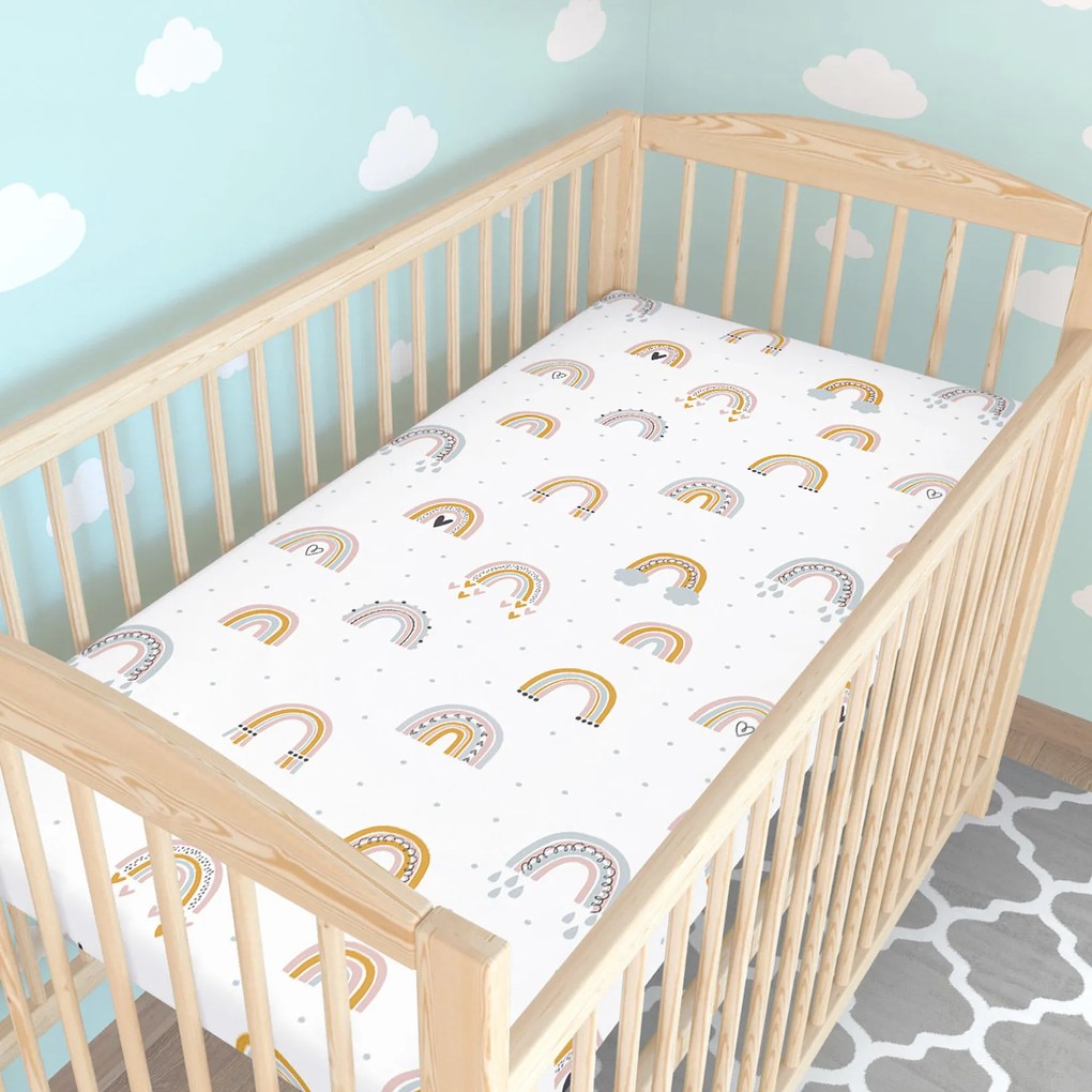 Goldea gyermek gumis pamut lepedő kiságyba - festett szivárványok 70 x 140 cm