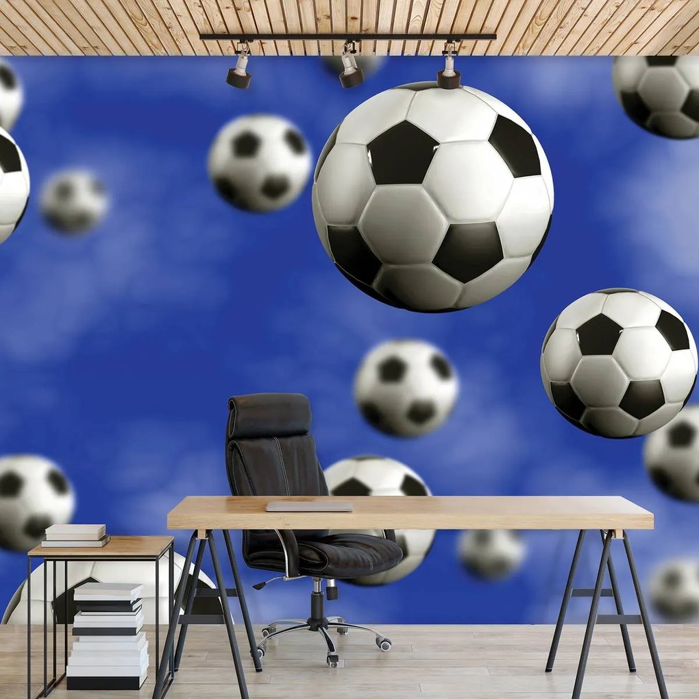 Fotótapéta - Futball-labdák a kék háttérben (152,5x104 cm)