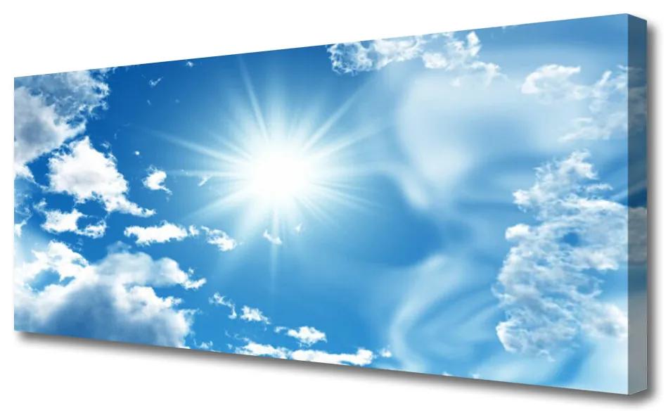 Vászonfotó Blue Sky Sun Clouds 120x60 cm