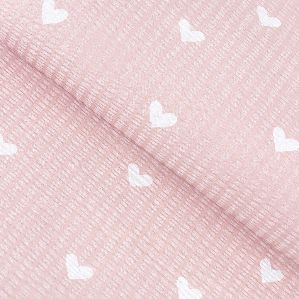 Goldea pamut krepp anyag - szívecskék, púderrózsaszín alapon 160 cm