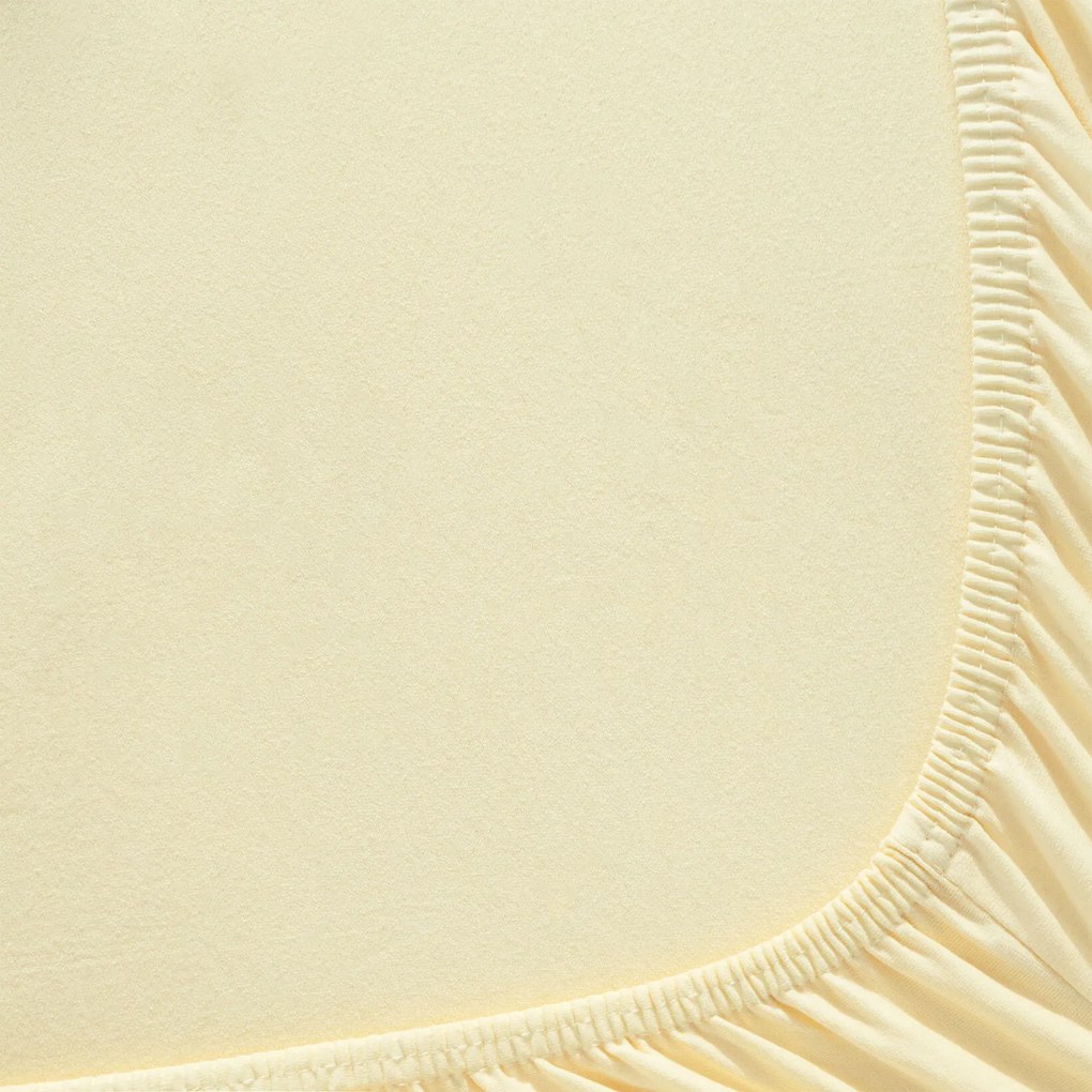 Goldea jersey gumis lepedő - banán sárga 140 x 200 cm