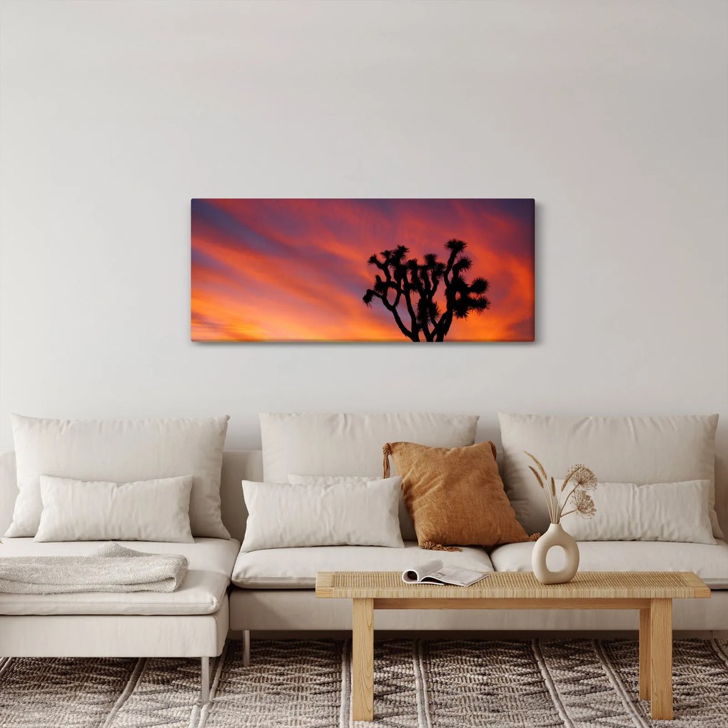 Vászonkép - Naplemente egy fa sziluettje felett (120x50 cm)