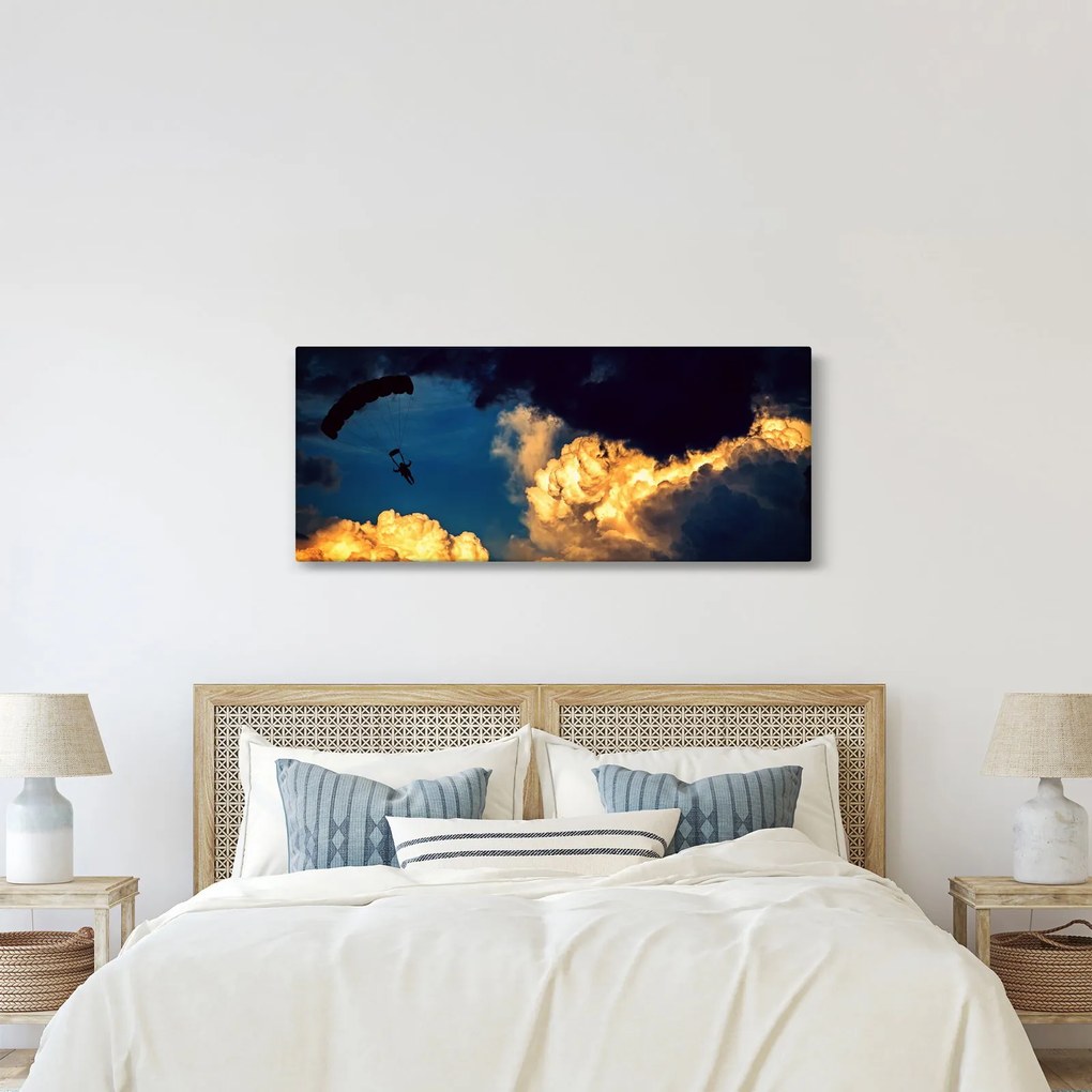 Ejtőernyős a felhőkben képe (120x50 cm)