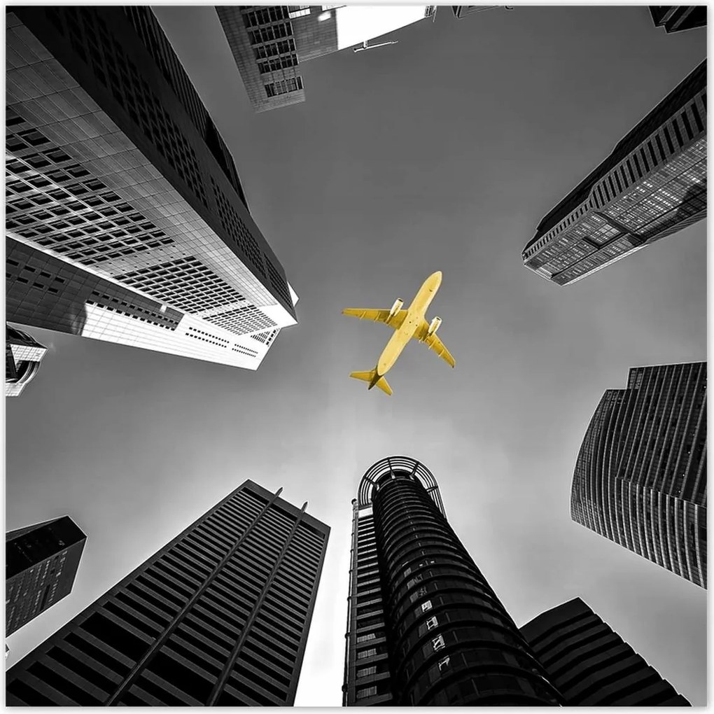 Poszterek 30x30 Sárga repülőgép a város felett