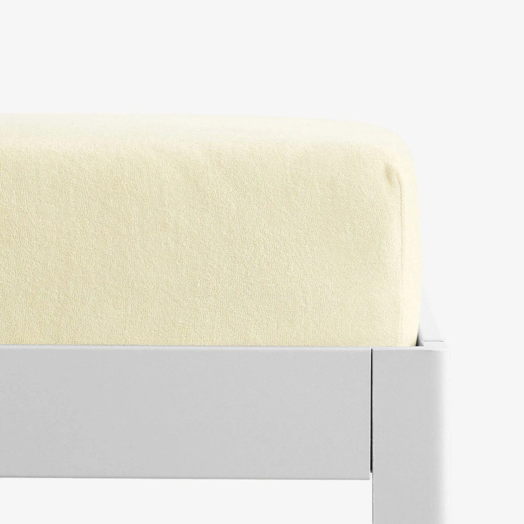 Goldea frottír gumis lepedő - világossárga 90 x 200 cm