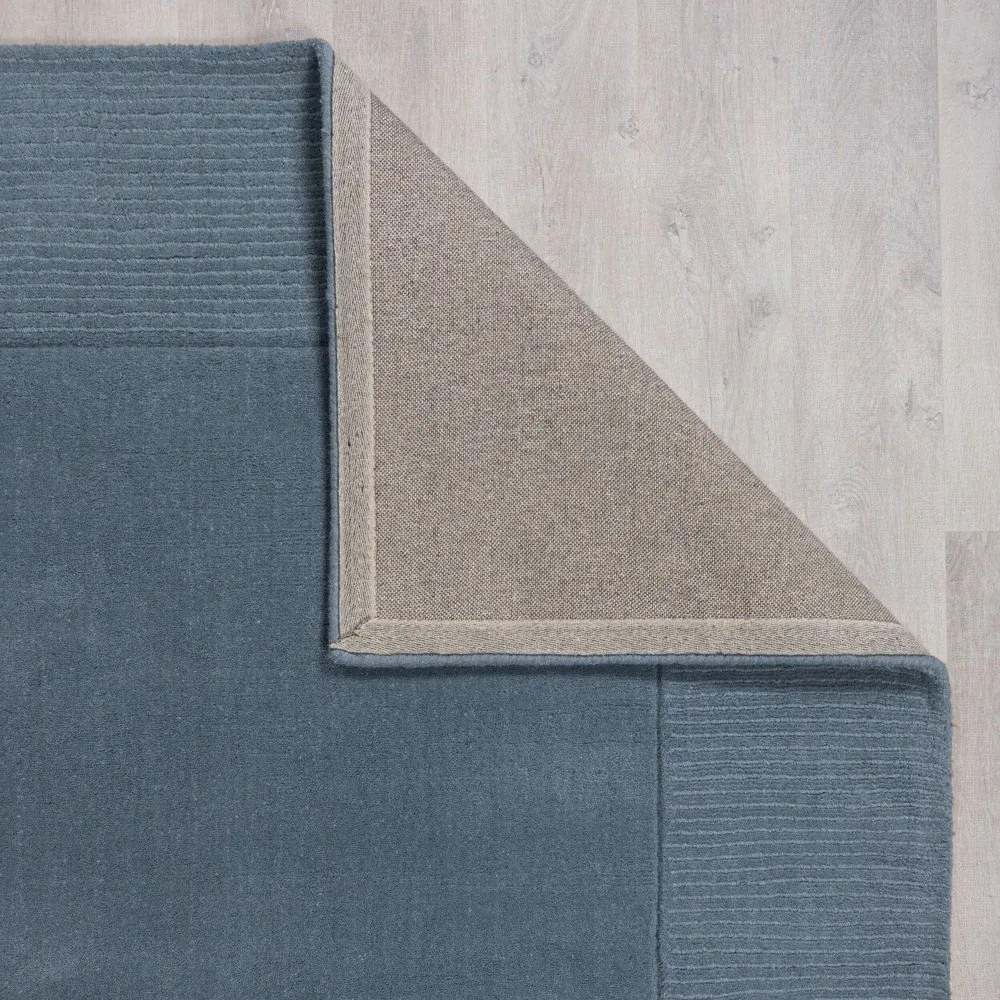 Sötétkék kézi szövésű gyapjú szőnyeg 120x170 cm Textured Wool Border – Flair Rugs
