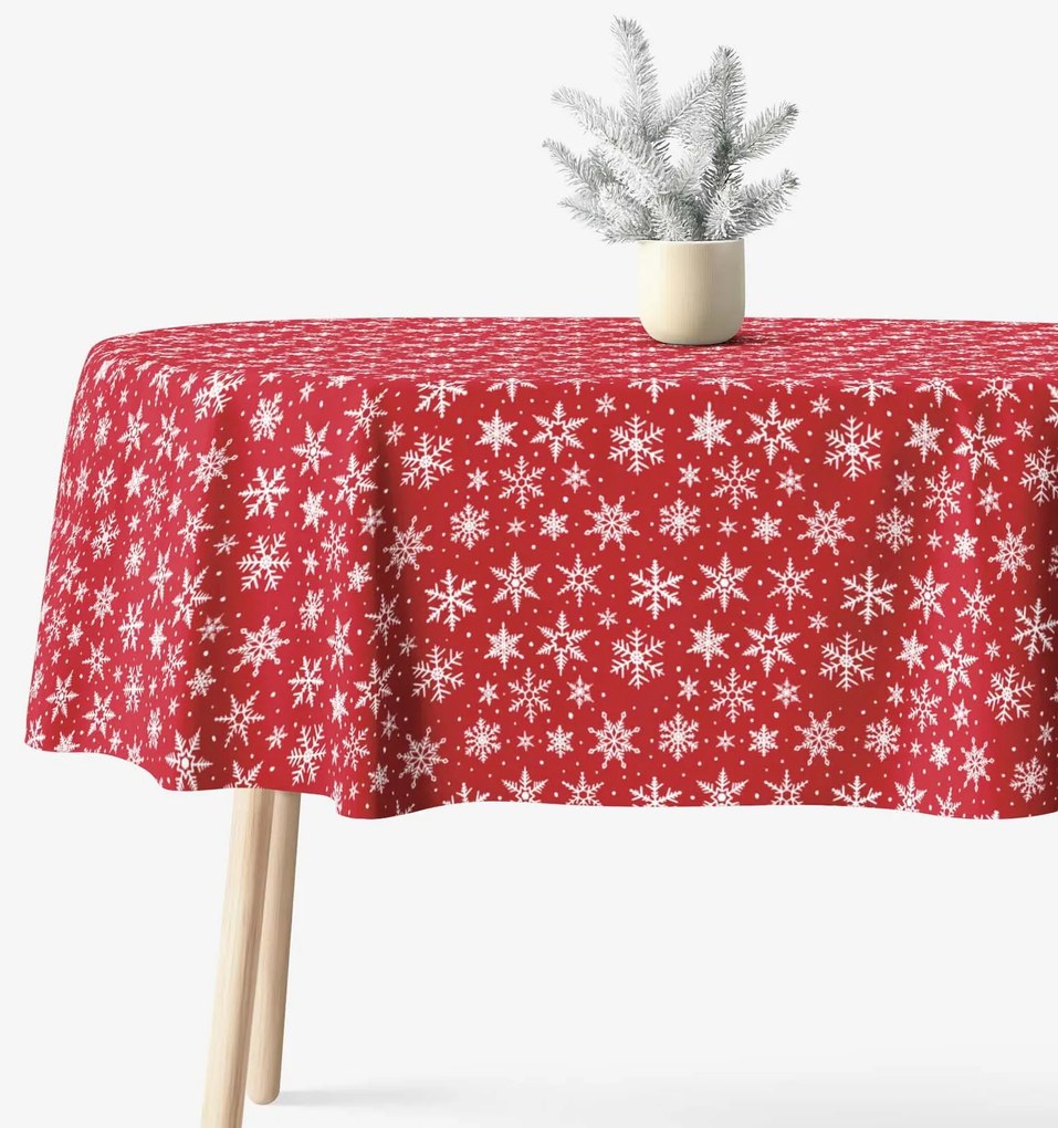 Goldea ovális karácsonyi terítő valencia - fehér pelyhek piros alapon 120 x 160 cm