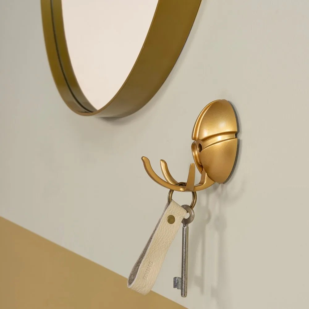 Aranyszínű fali műanyag akasztó Tick – Spinder Design