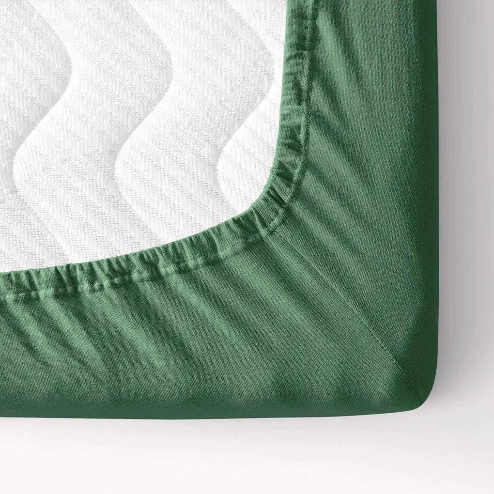 Goldea jersey körgumis lepedő - sötétzöld 180 x 200 cm