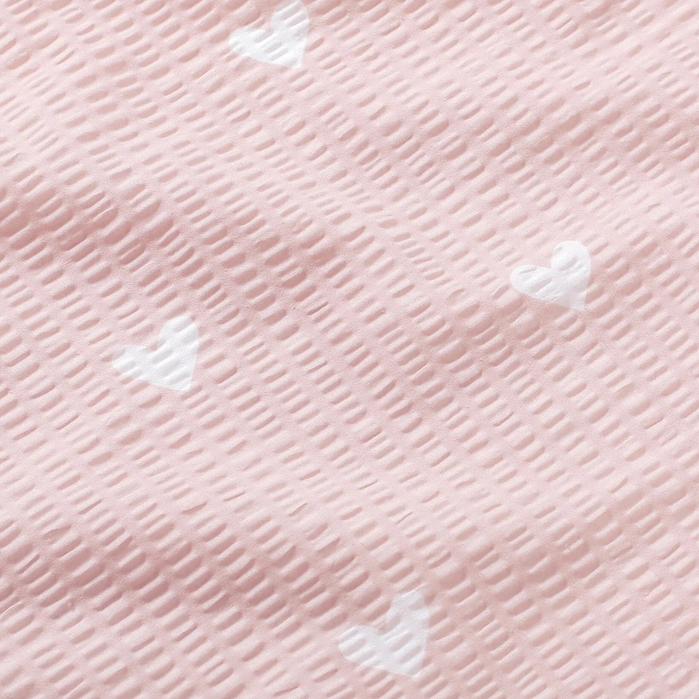 Goldea pamut krepp anyag - szívecskék, púderrózsaszín alapon 160 cm