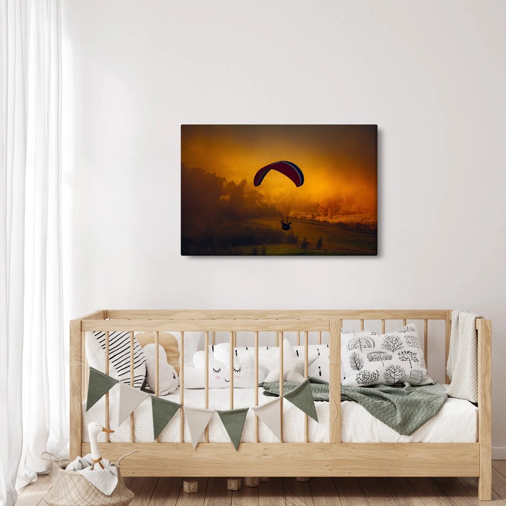 Ejtőernyős a naplementében képe (90x60 cm)