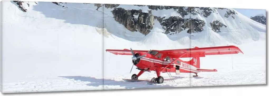Vászonkép 120x40 Piros repülőgép a hegyekben