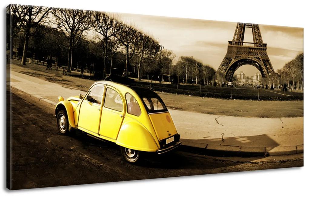 Vászonkép Sárga gépkocsi az Eiffel-torony előtt