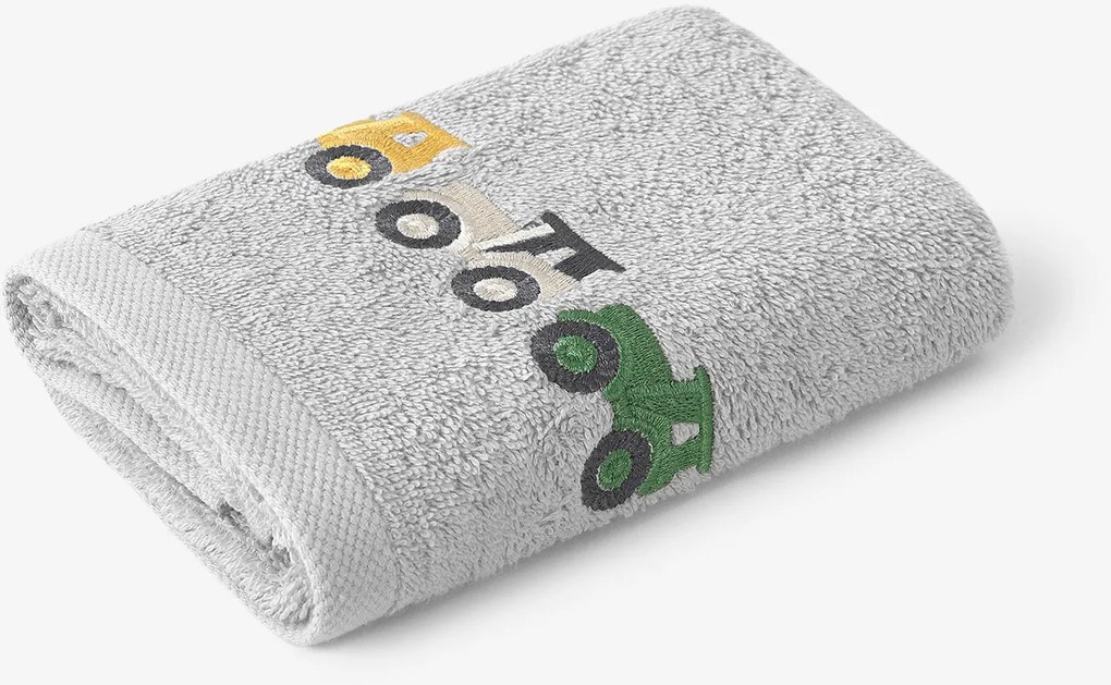 Goldea gyermek frottír törölköző - színes traktorok szürkén 30 x 50 cm