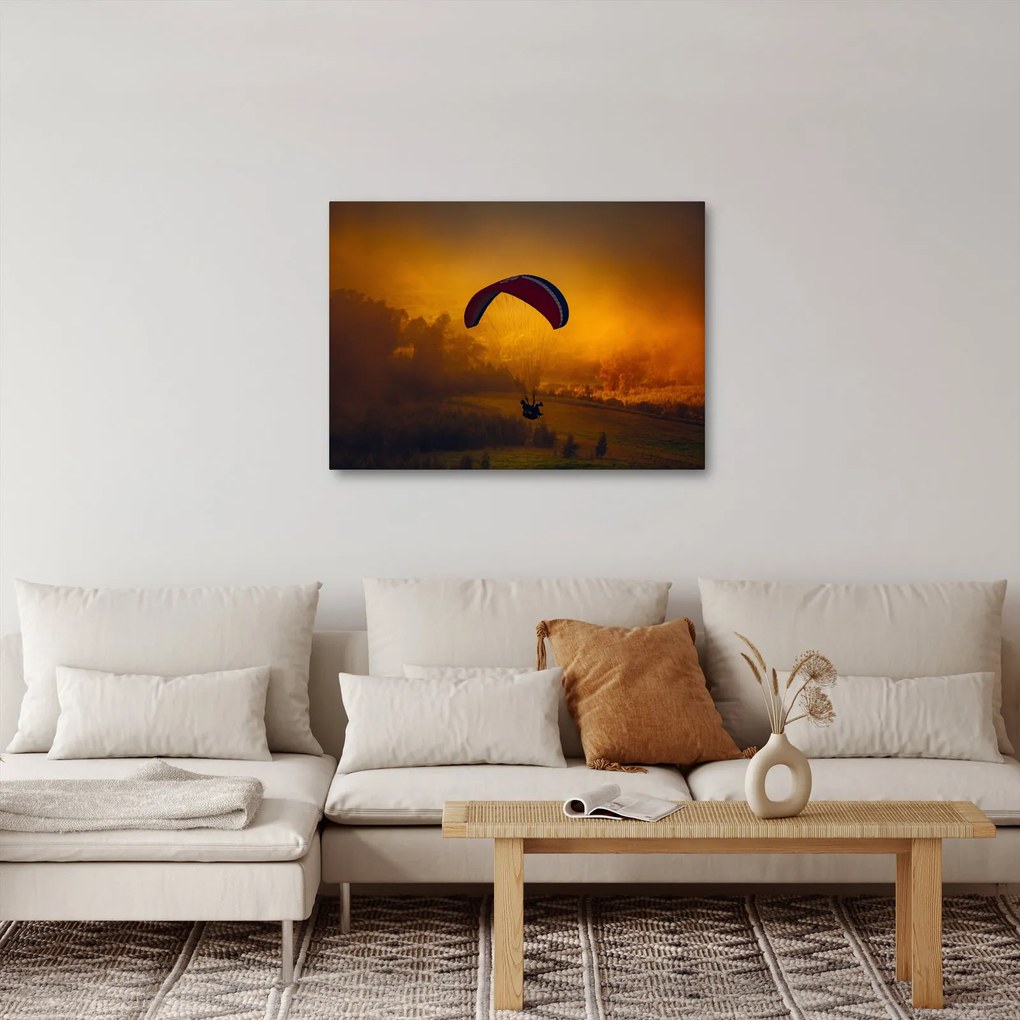 Ejtőernyős a naplementében képe (70x50 cm)