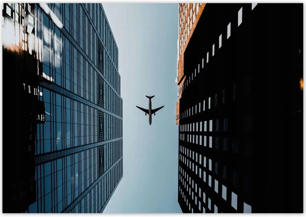 Poszterek 100x70 Repülőgép az épületek között