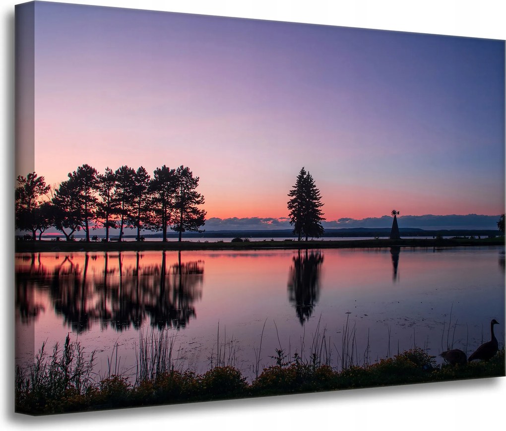 Vászonkép Naplemente a víz felett 70x50 cm