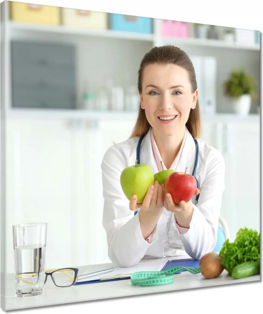 Vászonkép 50x50 Dietetikus hölgy almával