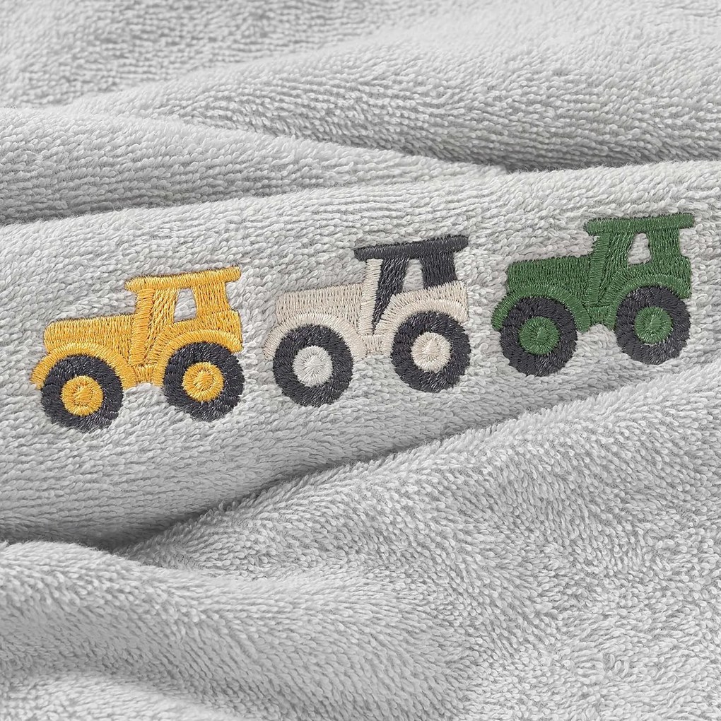 Goldea gyermek frottír törölköző - színes traktorok szürkén 30 x 50 cm