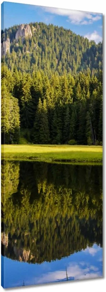 Vászonkép 40x100 Hegyi táj gyönyörű felhőkkel