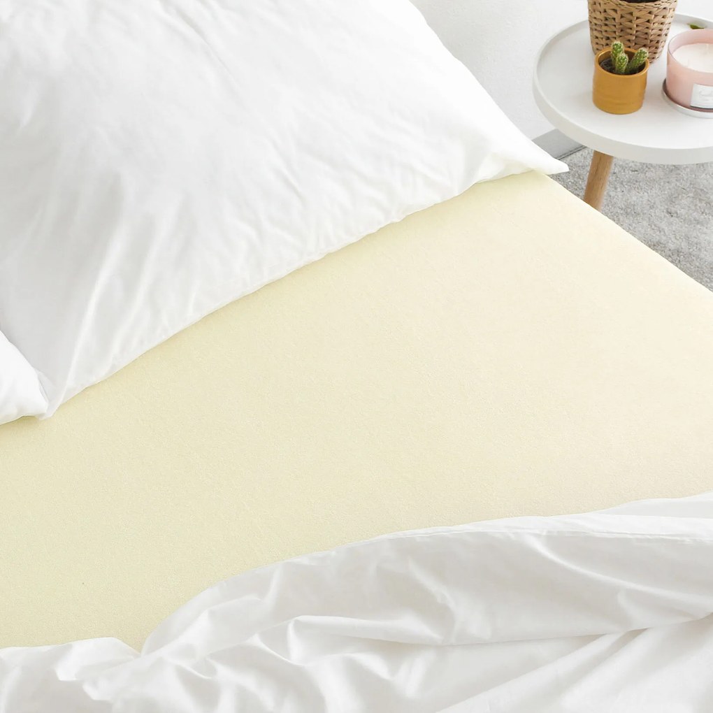 Goldea frottír gumis lepedő - világossárga 90 x 200 cm