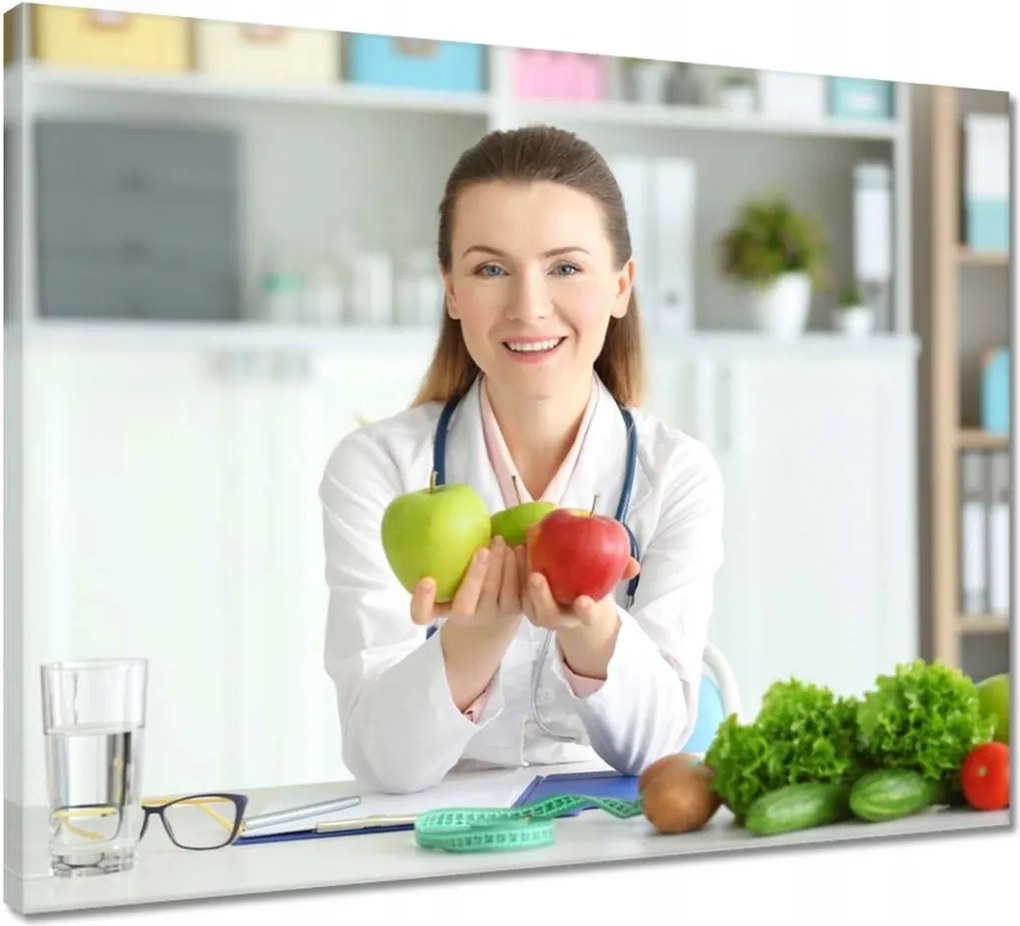 Vászonkép 50x40 Dietetikus hölgy almával