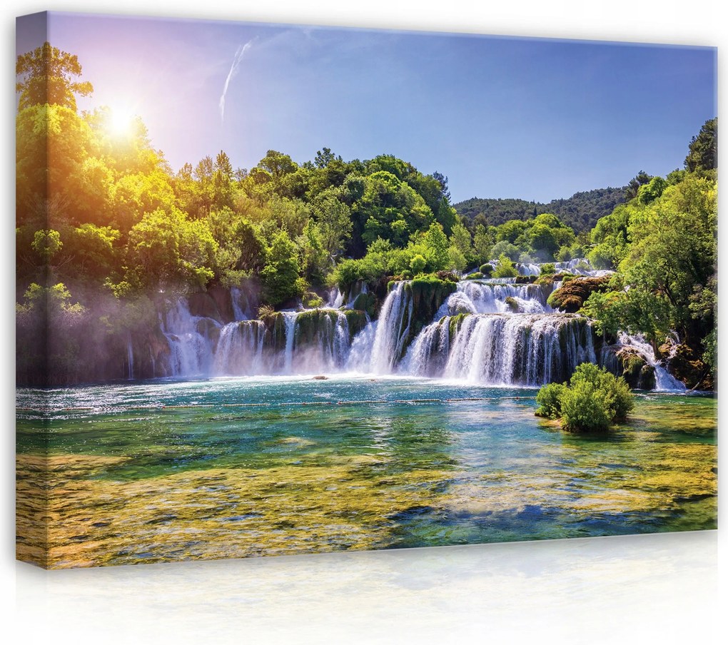 Vászonkép 70x50 Vízesés természet folyó erdő zöld nap fény víz