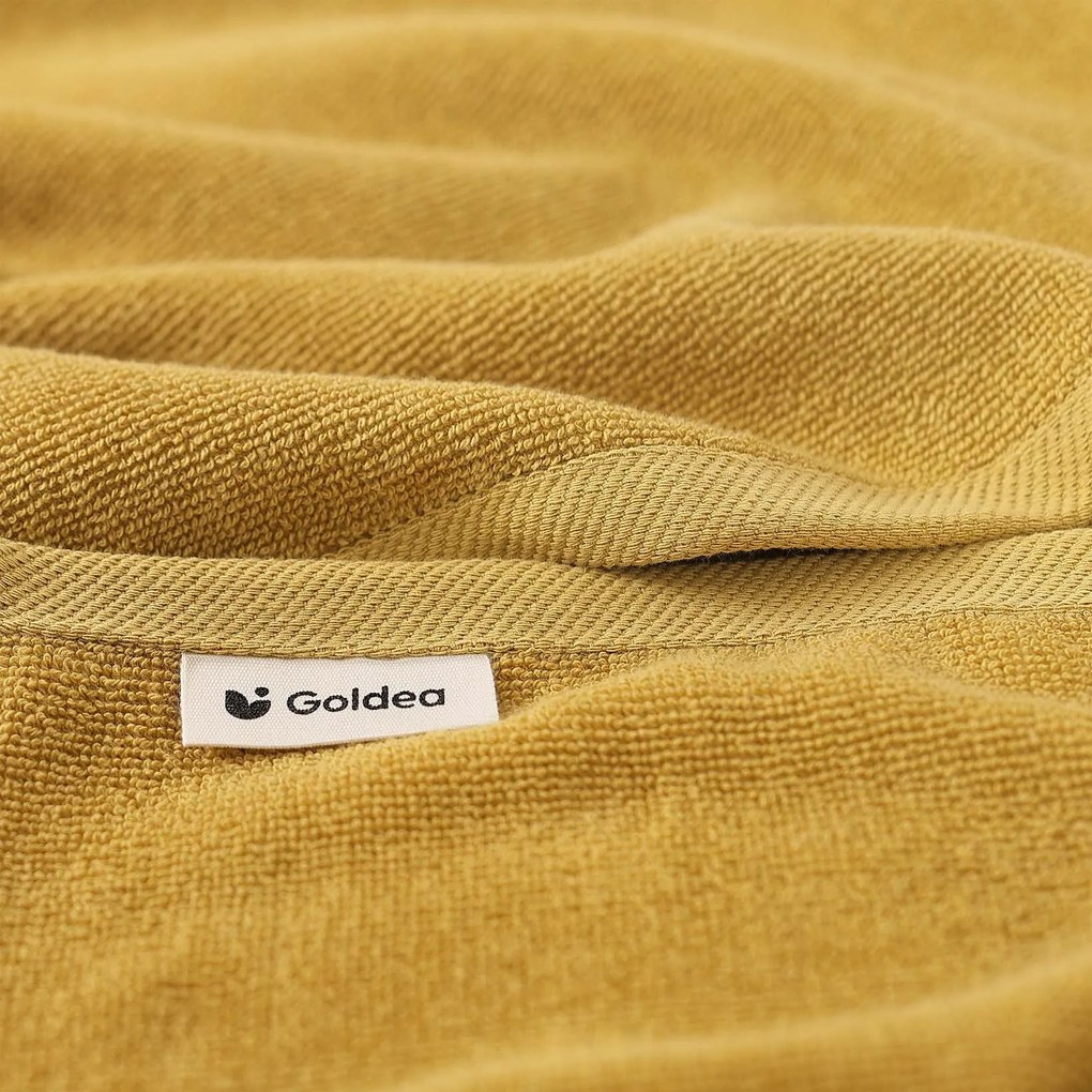 Goldea bordűr nélküli frottír törölköző és fürdőlepedő soft – mustárszínű 30 x 50 cm