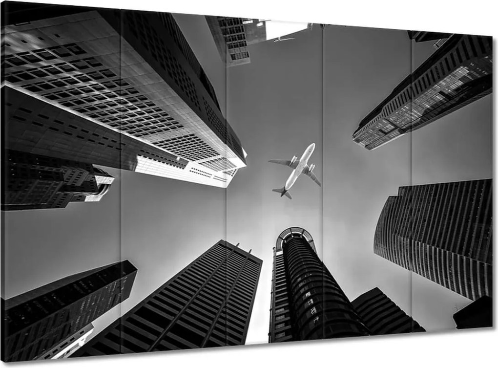 Vászonkép 100x70 Repülőgép a város felett