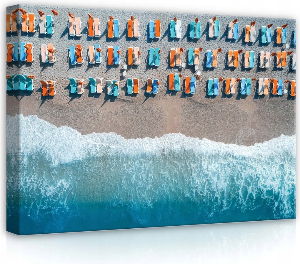 Vászonkép 70x50 Tengerpart nyár nyaralás légtechnika napozóágyak napernyők hullámok homok