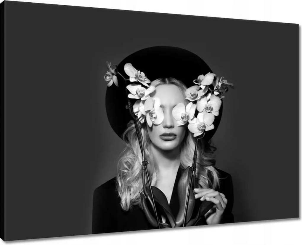 Vászonkép 70x50 Nő orchideával