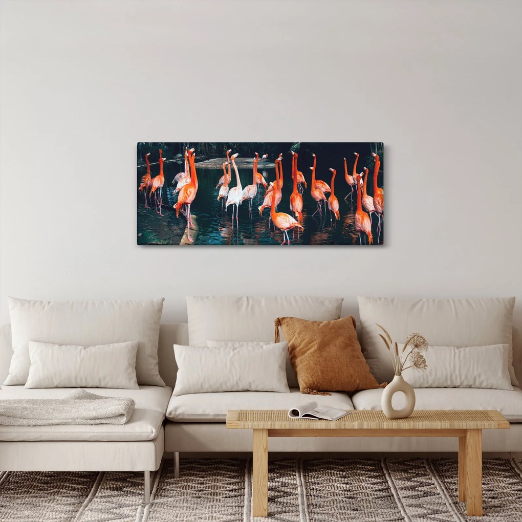 Vászonkép - Flamingók csordája (120x50 cm)