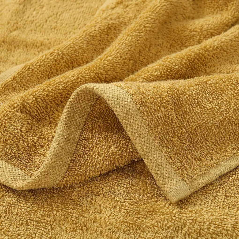 Goldea gyermek frottír törölköző - markolós a mustár színűn 30 x 50 cm