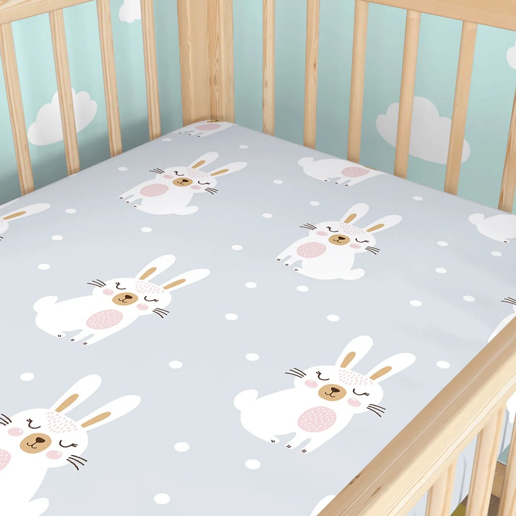 Goldea gyermek gumis pamut lepedő kiságyba - álmodozó nyuszik 70 x 140 cm