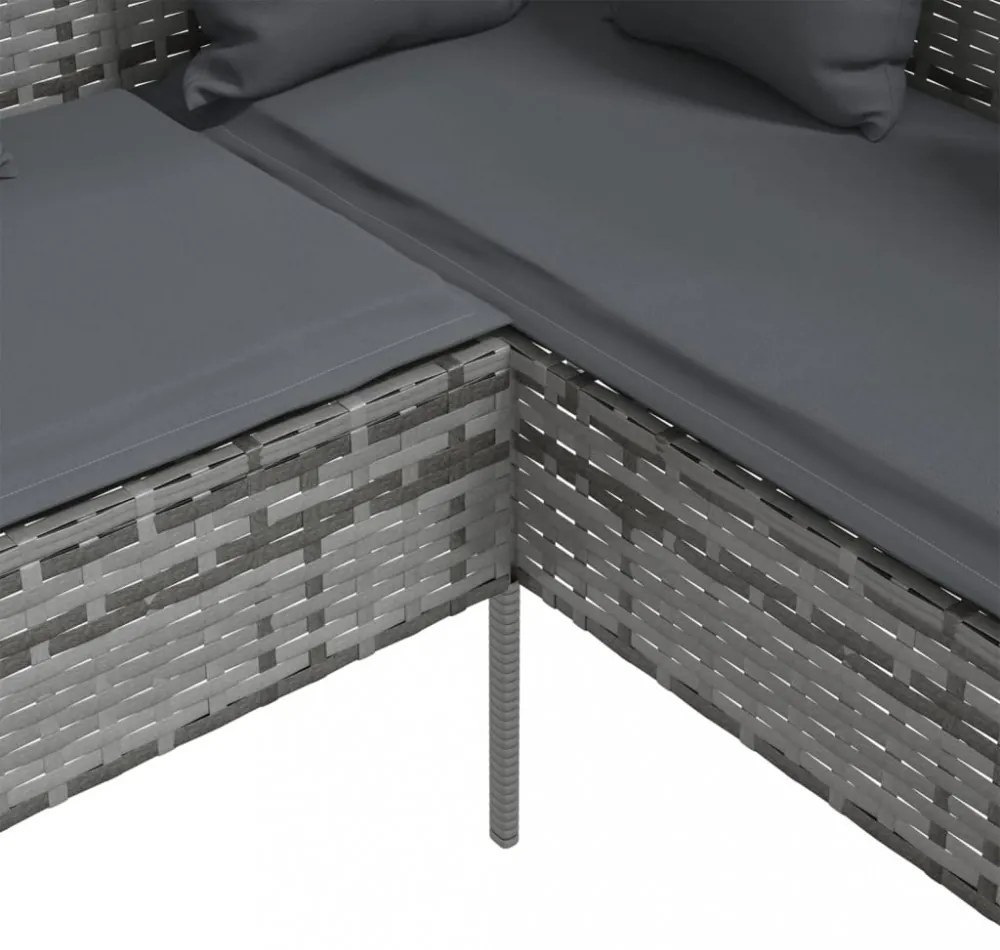 szürke polyrattan L-alakú kanapé párnákkal