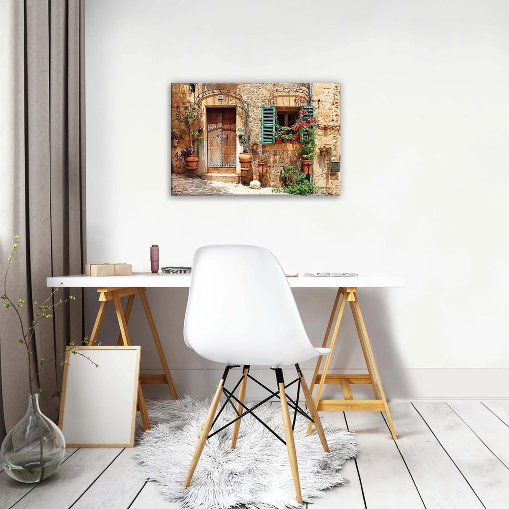 Vászonkép 60x40 Kőház virágokkal többpaneles kép egy hangulatos otthonhoz