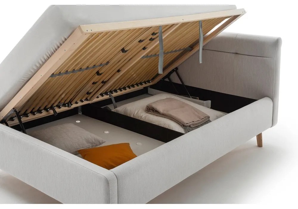 Világosszürke kárpitozott ágyneműtartós franciaágy ágyráccsal 140x200 cm Lotte – Meise Möbel