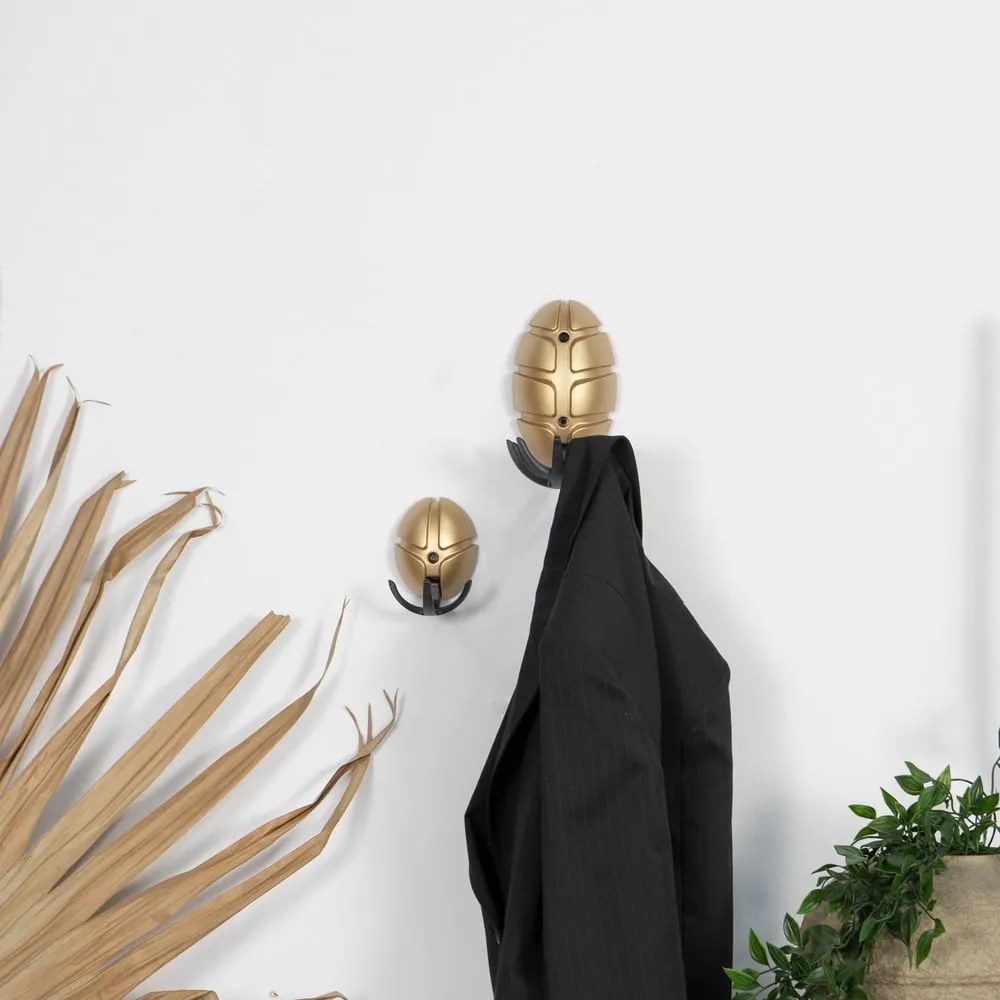 Fekete-aranyszínű fali műanyag akasztó Tick – Spinder Design