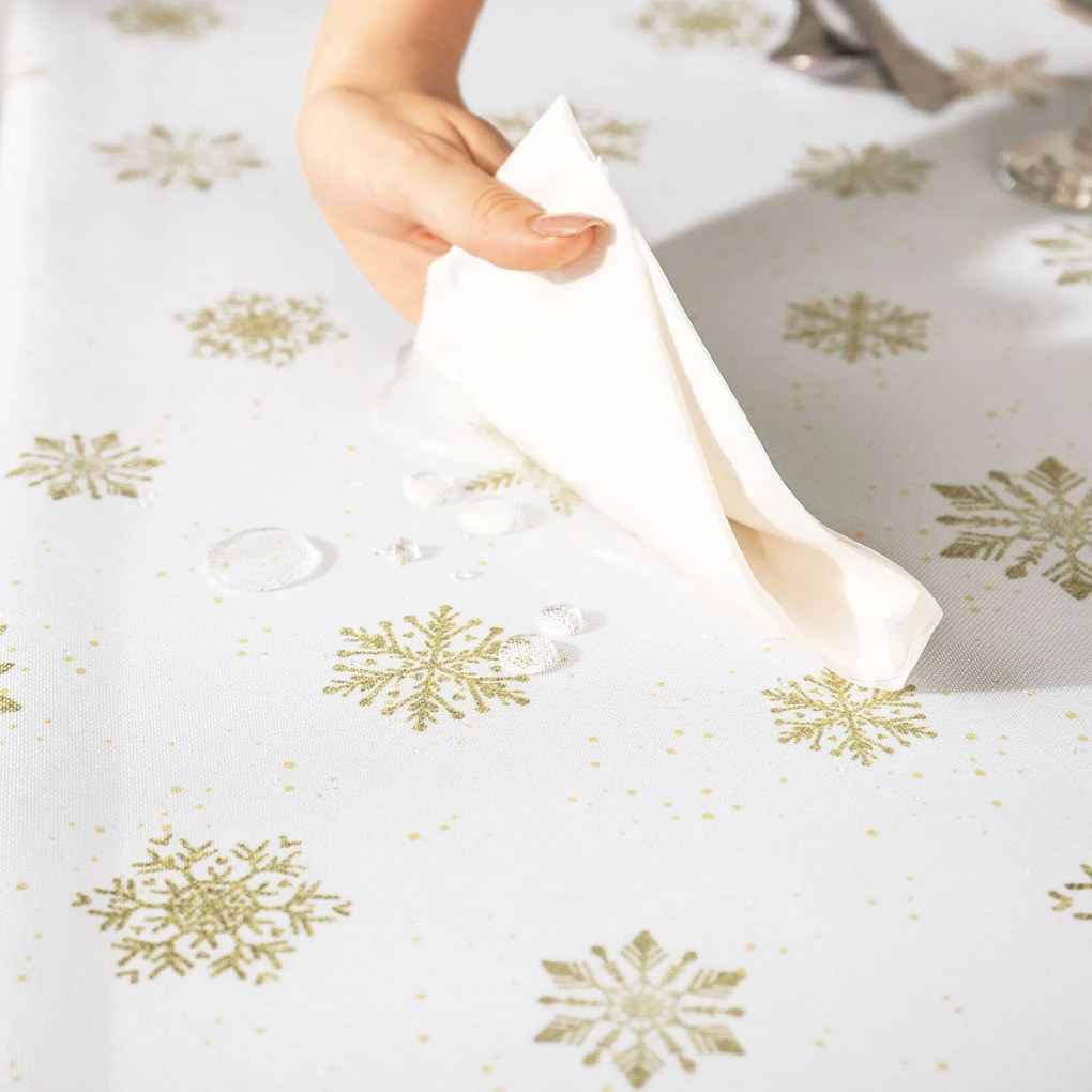 Goldea karácsonyi teflonbevonatú asztalterítő - arany hópelyhek 120 x 140 cm