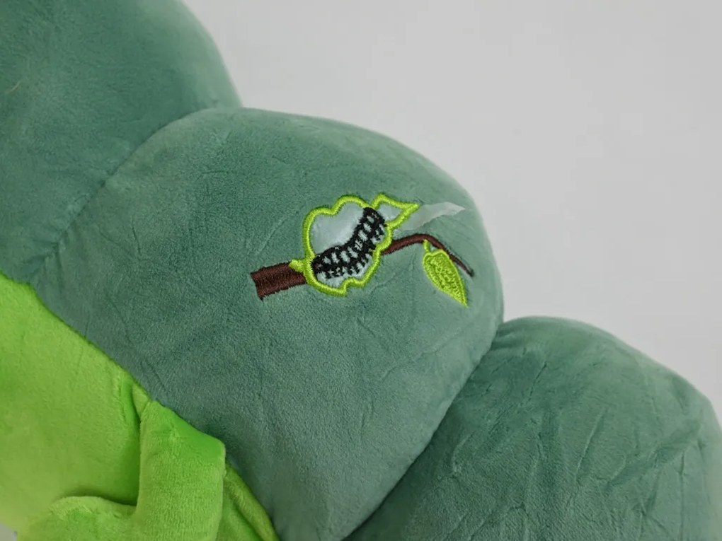 Plüss HERNYÓ zöld babatakaróval belül