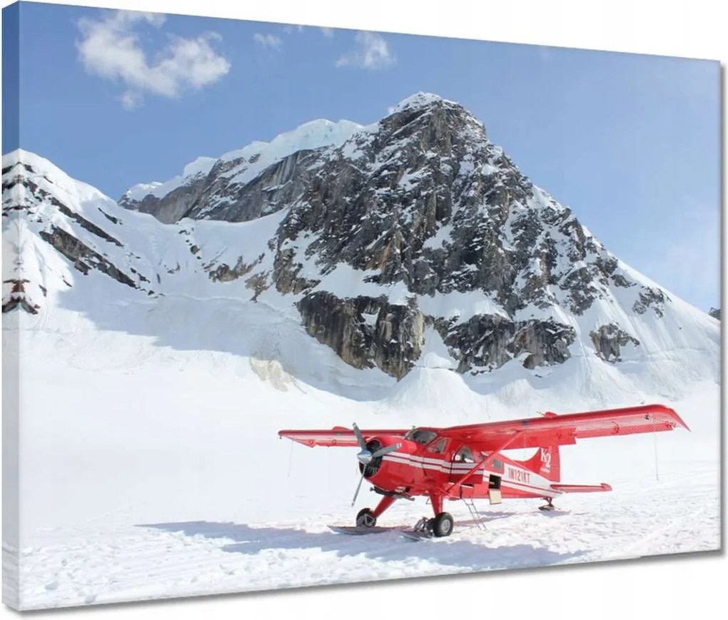 Vászonkép 40x30 Piros repülőgép a hegyekben