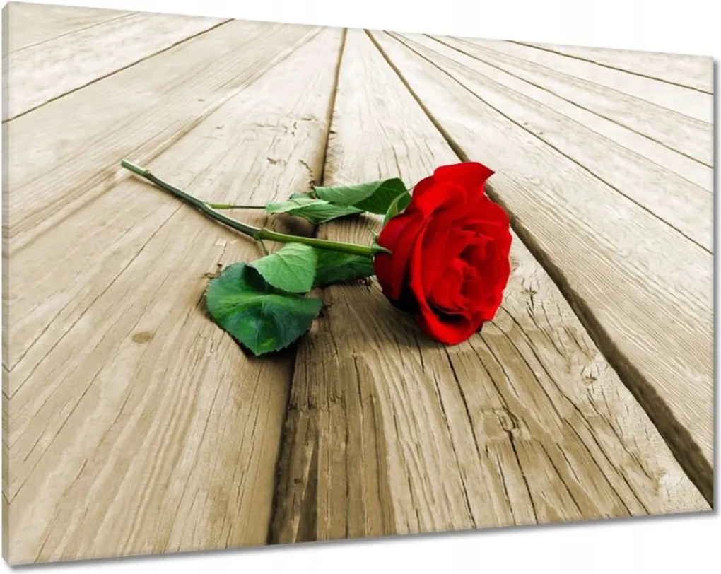 Vászonkép 100x70 Vörös rózsa a deszkákon