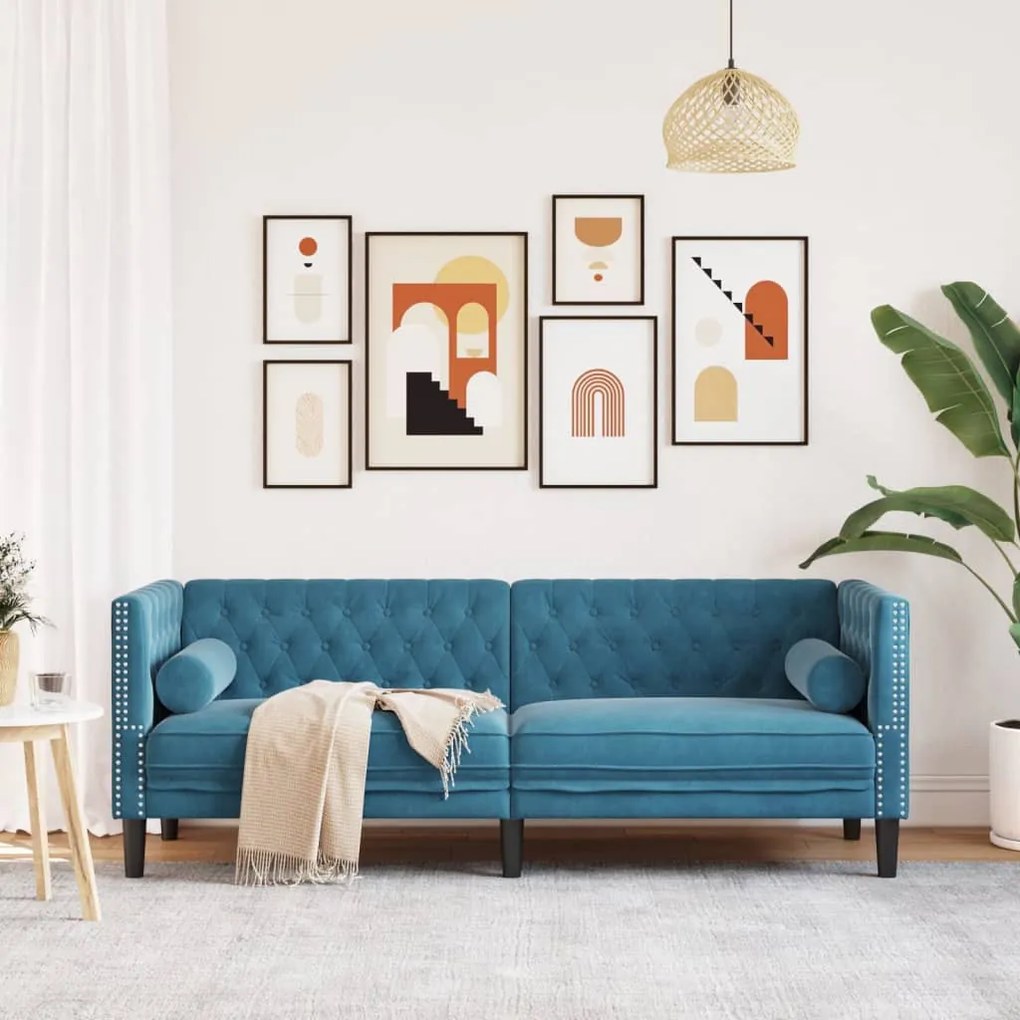 3 személyes kék bársony Chesterfield kanapé hengerpárnákkal