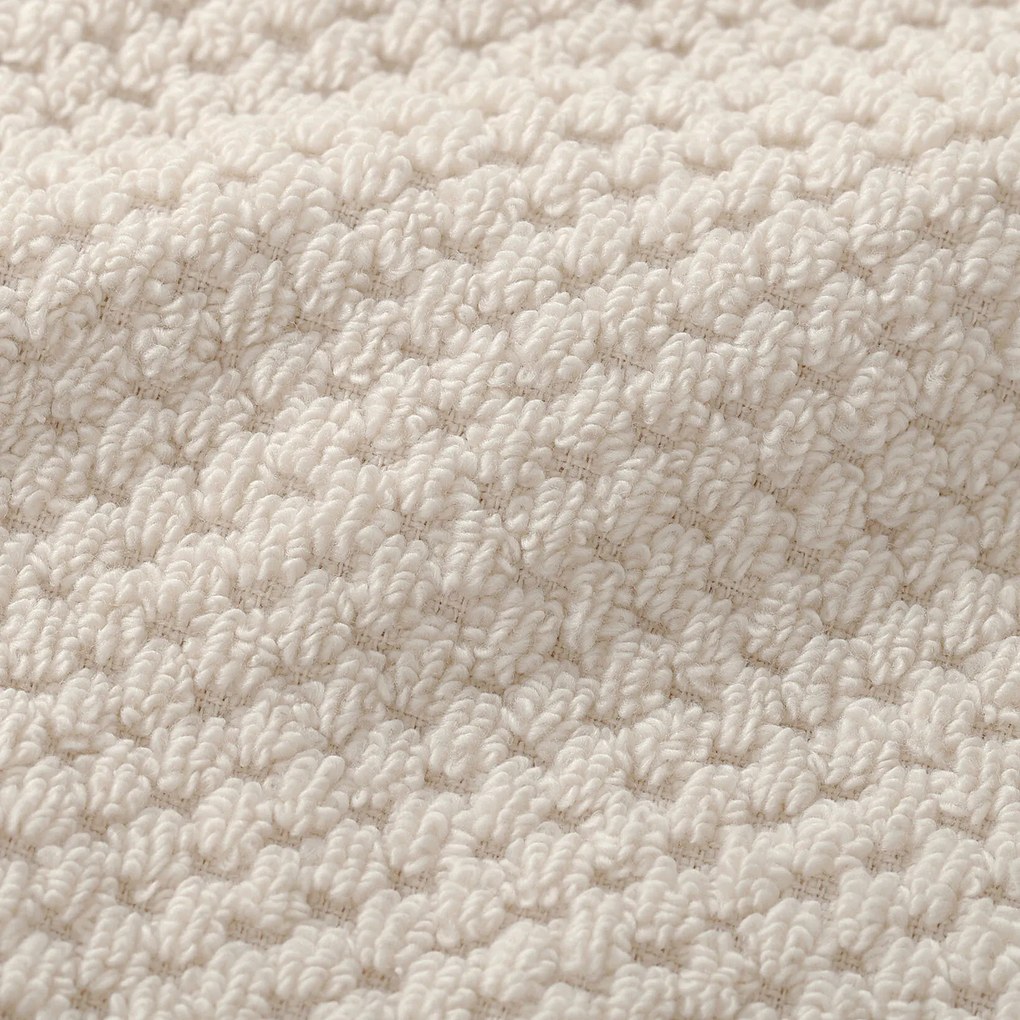 Goldea pamut frottír törölköző / fürdőlepedő micro pure - mandulaszín 70 x 140 cm