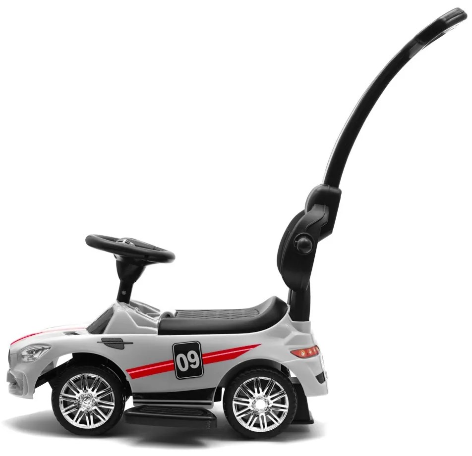 Zenélő bébitaxi vezetőrúddal Baby Mix RACER fehér