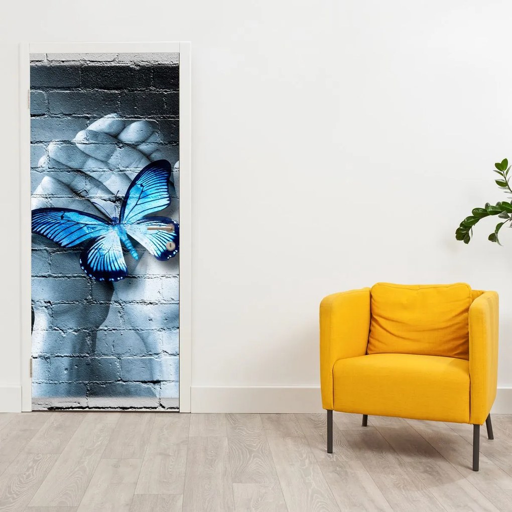 Fotótapéta ajtóra - Kék pillangó a falon (95x205cm)