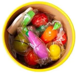 Wooden chopping vegetables in a bucket