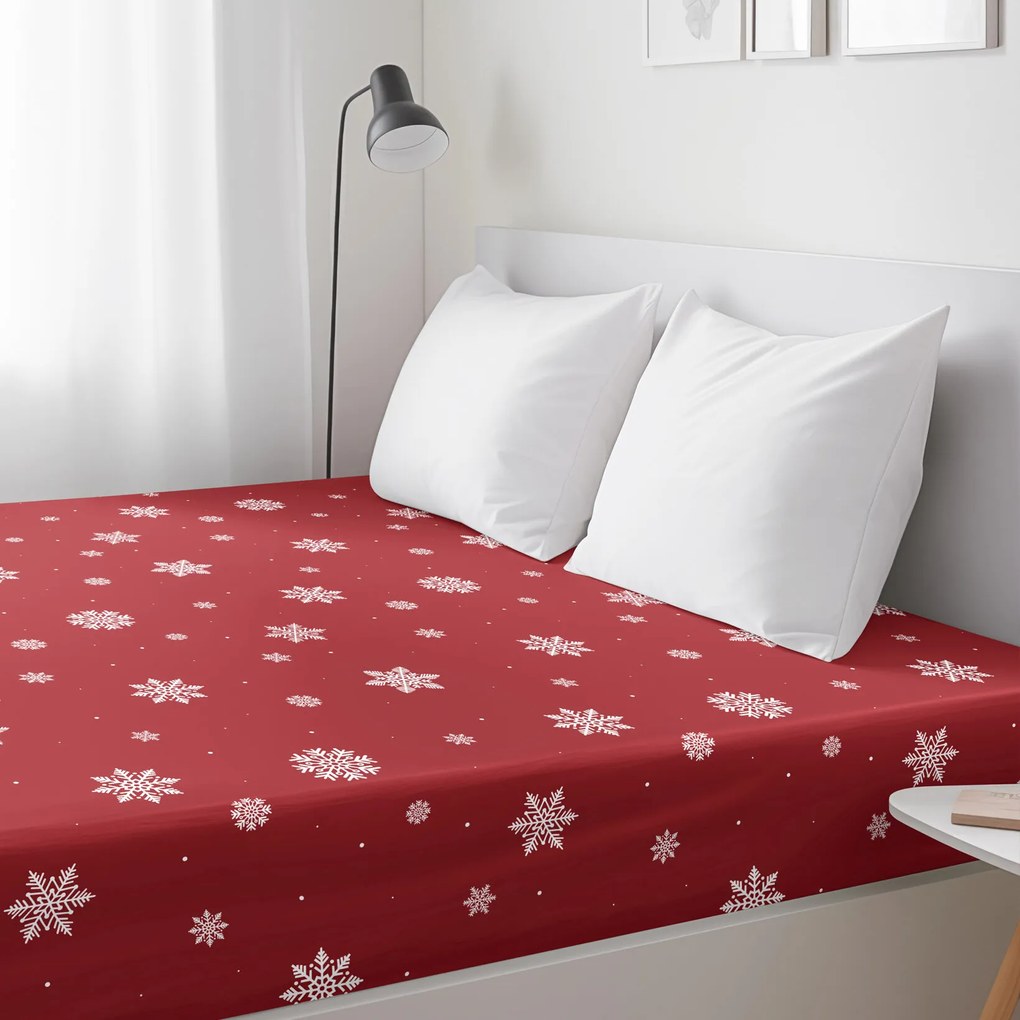 Goldea karácsonyi pamut körgumis lepedő - hópelyhek piros alapon 90 x 200 cm