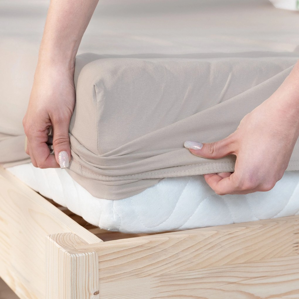 Goldea jersey gumis lepedő - szürkésbarna 120 x 200 cm