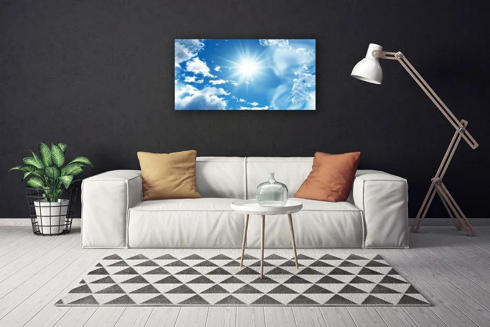 Vászonfotó Blue Sky Sun Clouds 125x50 cm